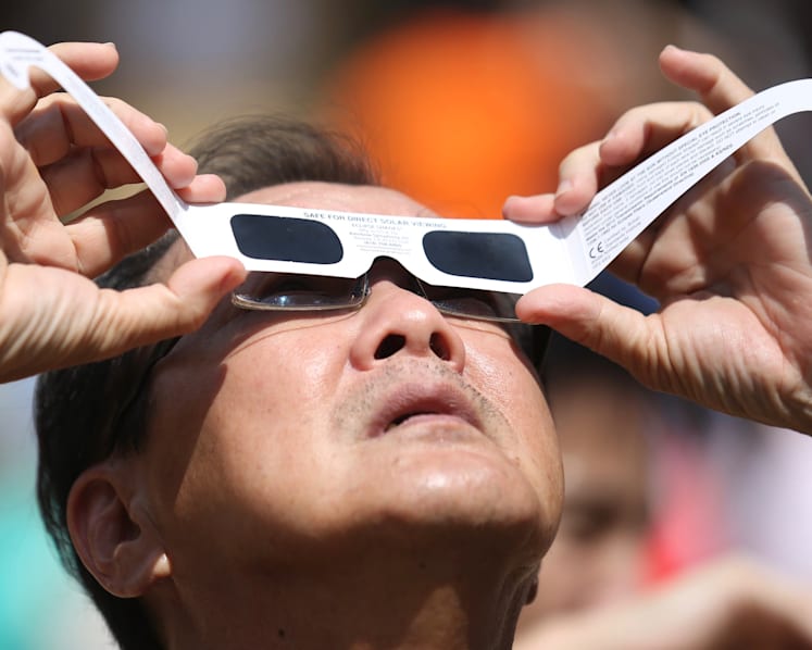 S’poreans at viewing sites islandwide crane their necks spellbound as moon blocks sun, leaving ‘ring of fire’