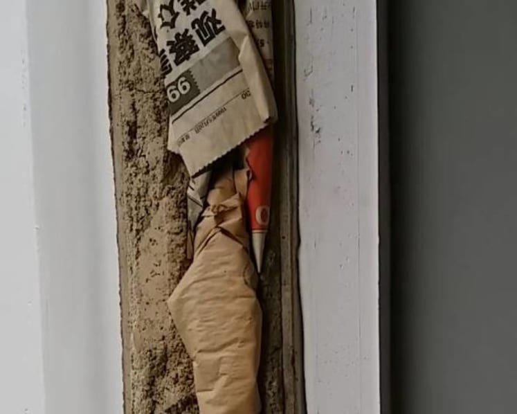 HDB investigating after newspaper found stuffed within walls of flat