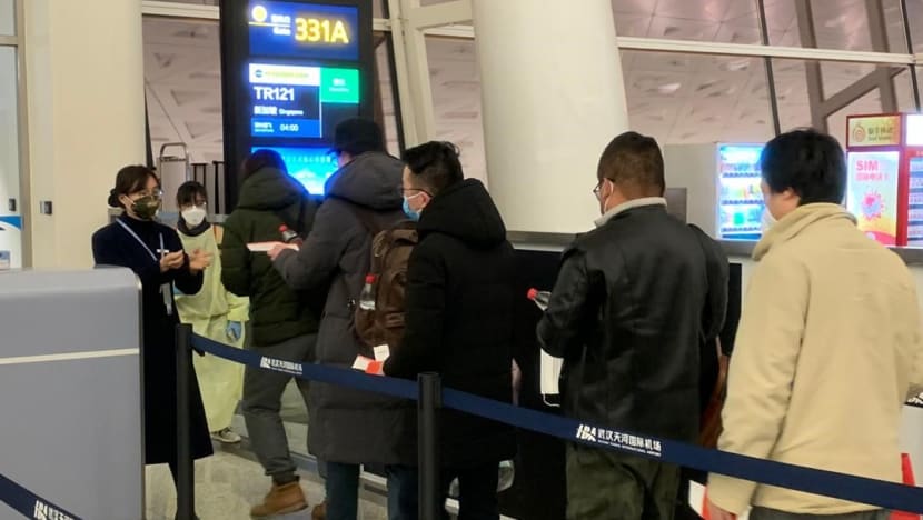 92 Singaporeans return home from Wuhan; 'some' who show symptoms of virus remain behind