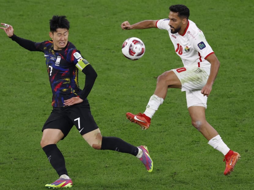 Jordan's midfielder Musa al-Tamari (right) and South Korea's midfielder Son Heung-min fight for the ball during the Qatar 2023 AFC Asian Cup semi-final football match between Jordan and South Korea at the Ahmad Bin Ali Stadium in Al-Rayyan, west of Doha on Feb 6, 2024.