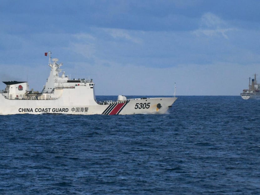 A Chinese Coast Guard ship sails near a Philippine vessel (right) that was part of a convoy of civilian boats in the disputed South China Sea on Dec 10, 2023. A Chinese Coast Guard ship sails near a Philippine vessel (right) that was part of a convoy of civilian boats in the disputed South China Sea on Dec 10, 2023.