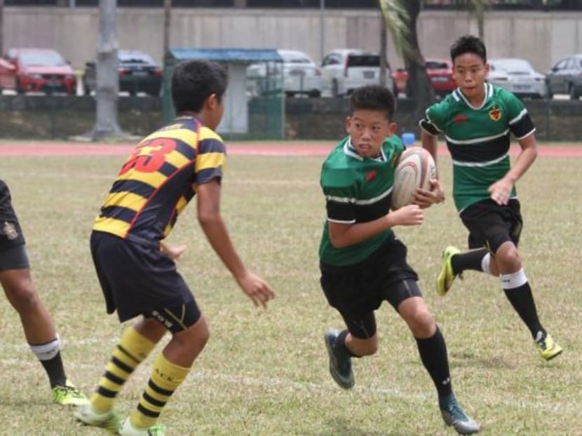 Anglo-Chinese School (ACS) Independent and Raffles Institution (RI) students. File photo: Singapore Rugby Union Anglo-Chinese School (ACS) Independent and Raffles Institution (RI) students. File photo: Singapore Rugby Union