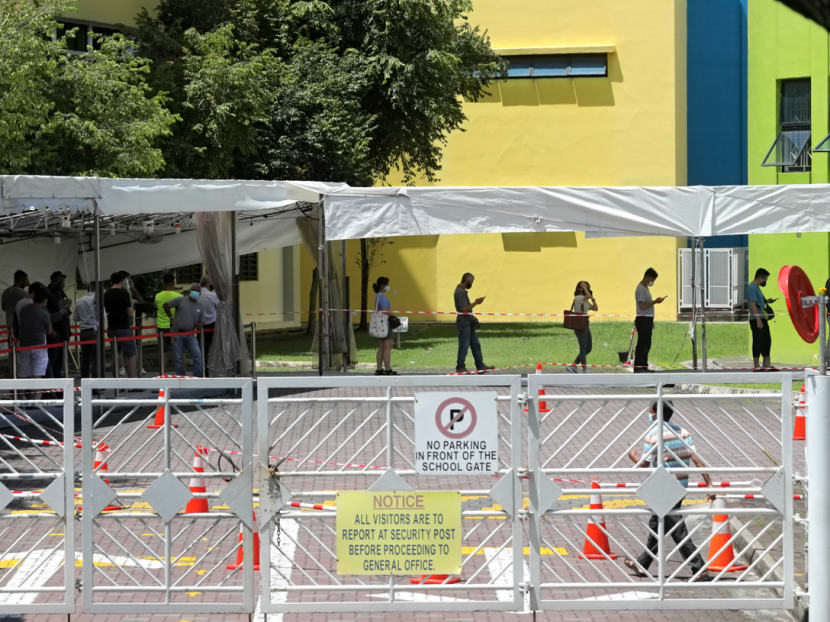 People queuing on May 3, 2021, at the former Da Qiao Primary School in Ang Mo Kio, one of the Covid-19 swab test centres. People queuing on May 3, 2021, at the former Da Qiao Primary School in Ang Mo Kio, one of the Covid-19 swab test centres.