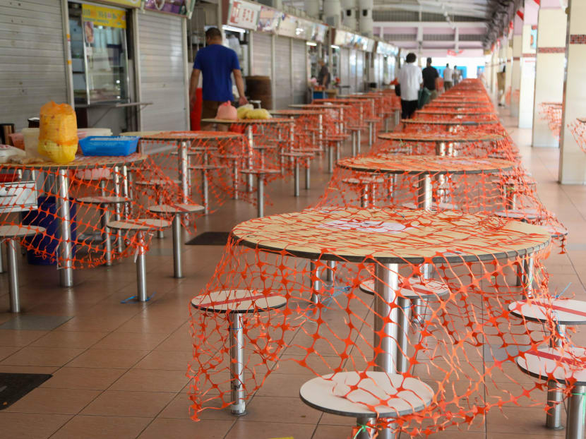 Cordoned-off tables and chairs at a hawker centre in Bedok on the first day of the return to Phase 2 (heightened alert). Cordoned-off tables and chairs at a hawker centre in Bedok on the first day of the return to Phase 2 (heightened alert).