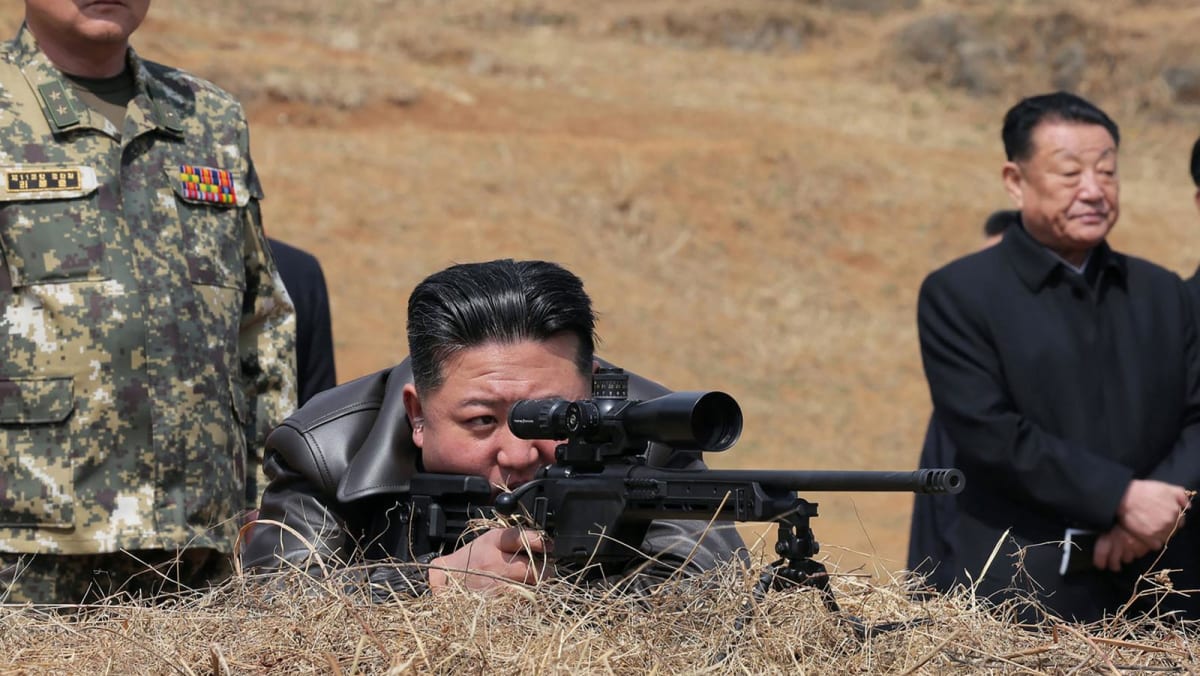 North Korea’s Kim fires new sniper rifle while visiting troops