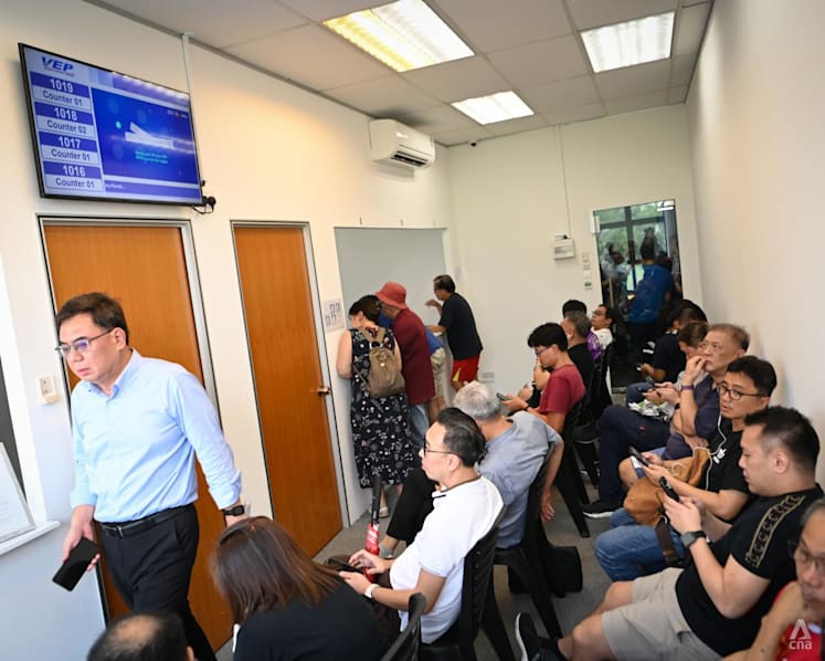 Singapore drivers rush to Malaysia’s VEP information counter in Woodlands industrial park to seek help