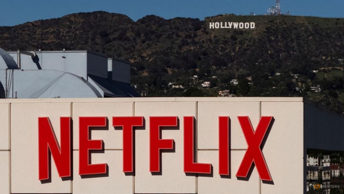 Netflix slightly beats revenue estimates, shares slide amid bidding war ...