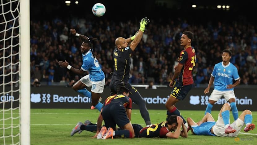 Napoli move top with battling 2-1 win over Genoa