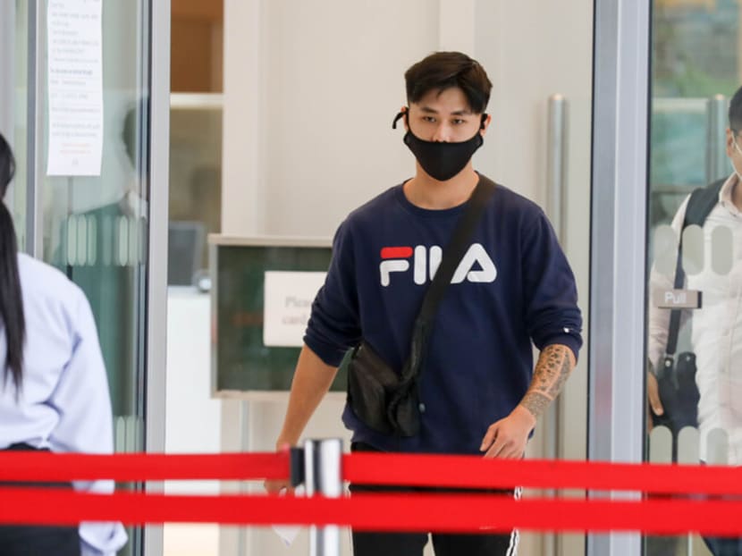 Gabriel Heng Jing Heng leaving the State Courts on April 28, 2021.