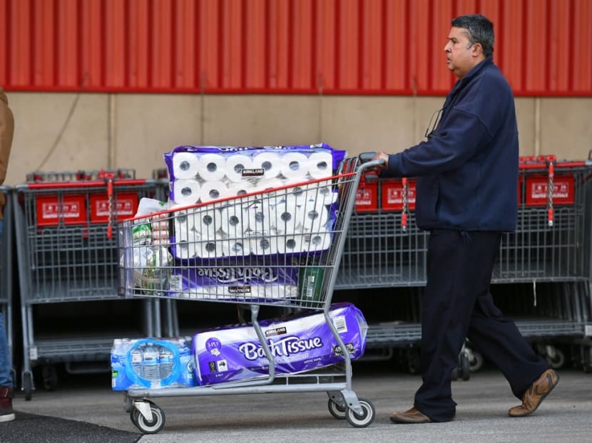 A man leaves a supermarket with a trolley full of toilet paper and cleaning products as fears of a second wave of Covid-19 sparked a rush on some items in Melbourne on June 24, 2020. A man leaves a supermarket with a trolley full of toilet paper and cleaning products as fears of a second wave of Covid-19 sparked a rush on some items in Melbourne on June 24, 2020.