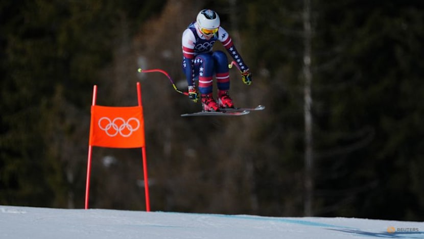 Alpine skiing-Johnson wins downhill after big crash for teammate Vonn