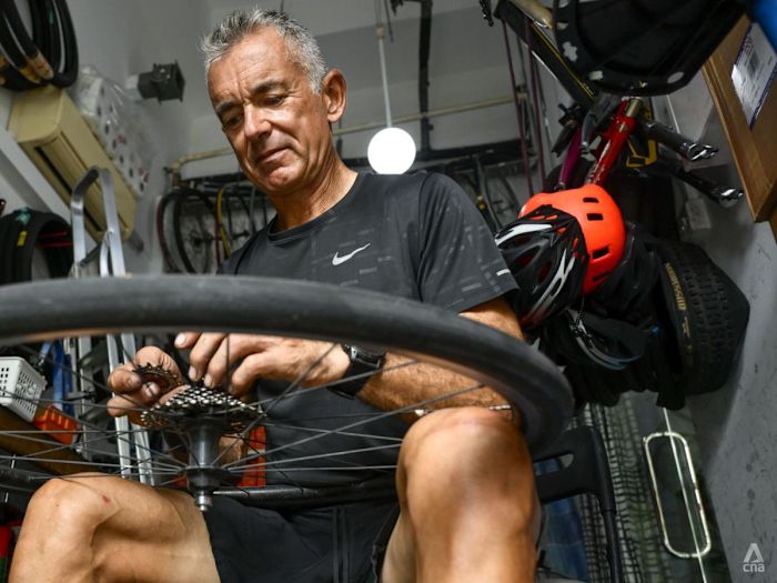 Once a banking high-flyer, this expat repairs bikes for free for migrant workers and others in need