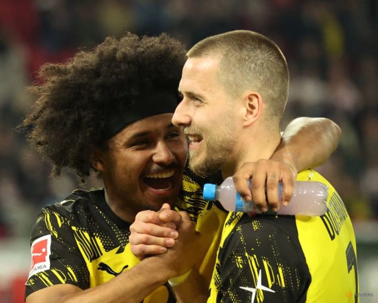 Dortmund score twice in stoppage time to beat Stuttgart 2-0