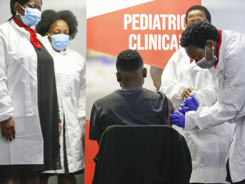 A healthcare worker administers a Sinovac Covid-19 vaccine on a minor at the Sefako Makgatho Health Sciences University in Pretoria, on September 10, 2021.