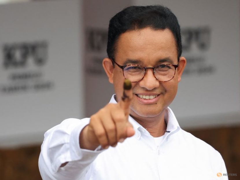 Presidential candidate Anies Baswedan shows his ink-stained finger after casting his vote at a polling station during the general election in Jakarta, Indonesia, on Feb 14, 2024. Presidential candidate Anies Baswedan shows his ink-stained finger after casting his vote at a polling station during the general election in Jakarta, Indonesia, on Feb 14, 2024.