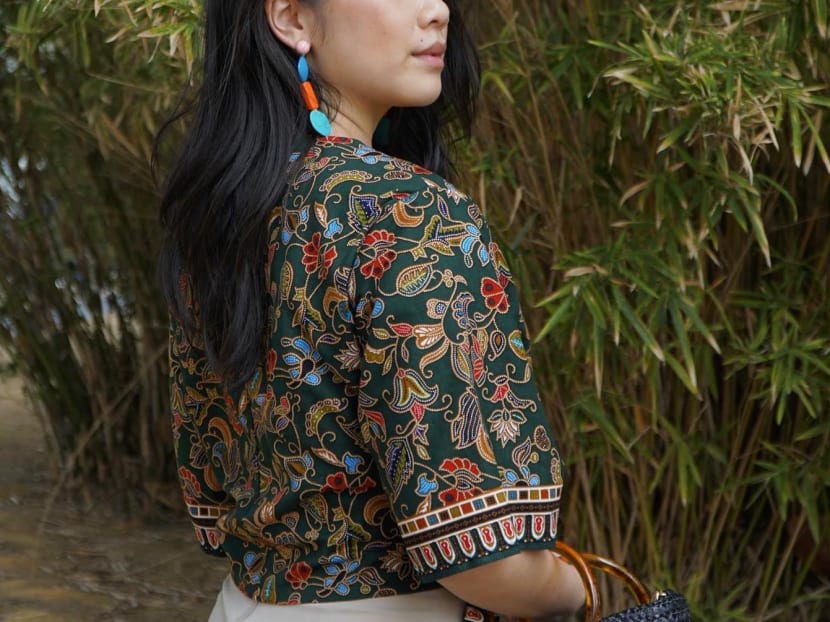 A cropped tank top from Makerly SG featuring a print similar to Singapore Airlines’ signature sarong kebaya uniform.