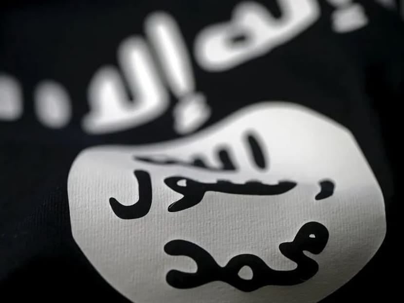 A flag of the Islamic State in Iraq and Syria (Isis). A 17-year-old secondary school student had been radicalised by a foreign online contact who introduced him to pro-Isis social media groups in 2017, MHA said. A flag of the Islamic State in Iraq and Syria (Isis). A 17-year-old secondary school student had been radicalised by a foreign online contact who introduced him to pro-Isis social media groups in 2017, MHA said.
