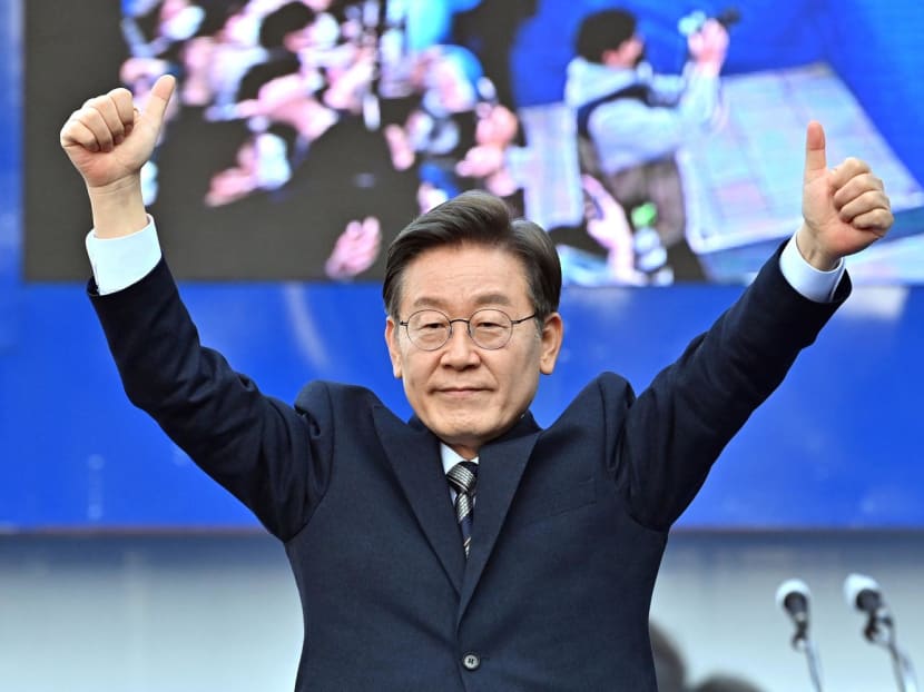 This picture taken on March 3, 2022 shows South Korea's presidential candidate Lee Jae-myung of the Democratic Party gesturing to his supporters during an election campaign in Seoul ahead of the March 9 presidential election. This picture taken on March 3, 2022 shows South Korea's presidential candidate Lee Jae-myung of the Democratic Party gesturing to his supporters during an election campaign in Seoul ahead of the March 9 presidential election.