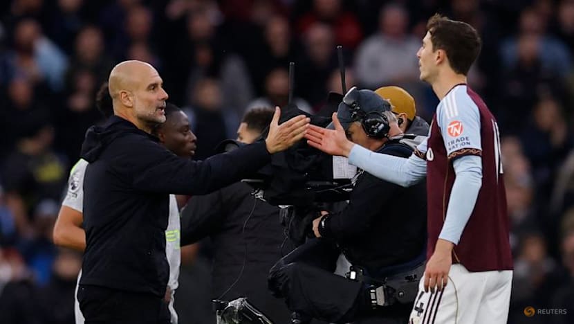 Man City's Guardiola apologises for confrontation with cameraman