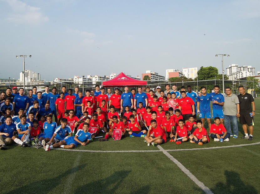 Manchester United legends Ryan Giggs and Gary Neville with the participants of Home United's football clinic. All photos in this report: Home United Football Club