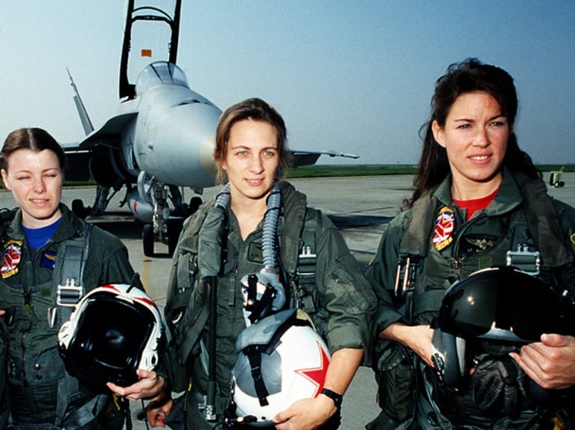 Tammie Jo Shults (right), seen here with other women pilots of the Tactical Electronic Warfare Squadron 34, has been hailed as a hero for safely landing the plane with 149 people on board.
