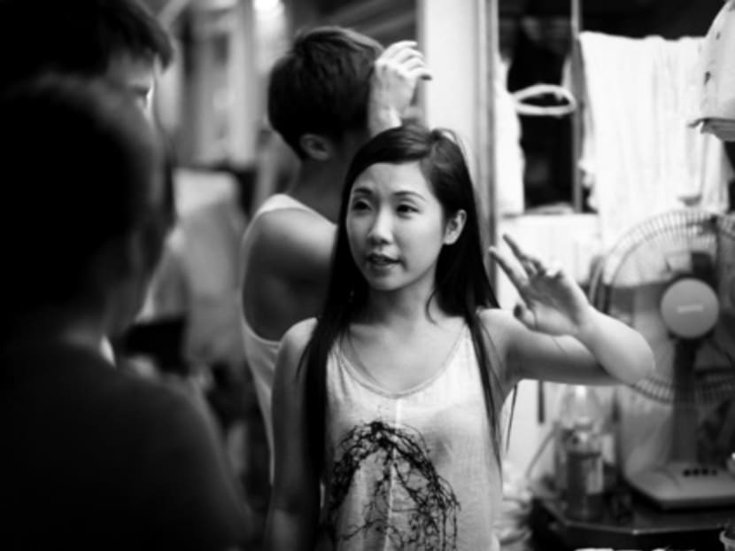 Ms Huang taking orders at her parents’ Wow Wow West stall. Photo: Youth Hawkerprise