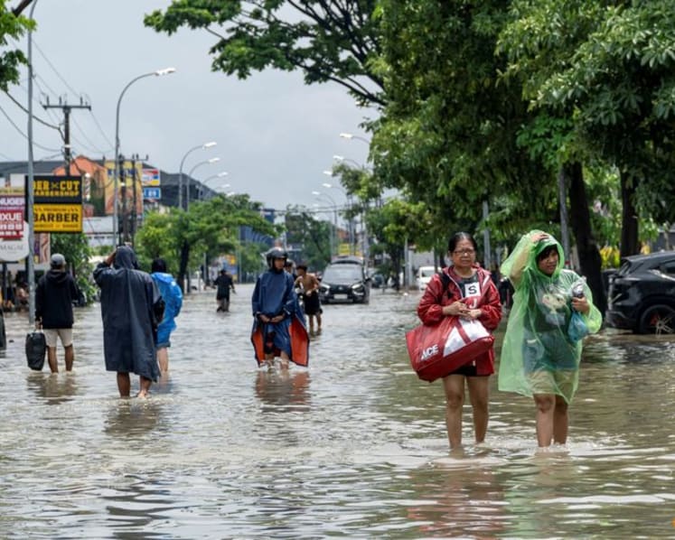 Bali floods kill 14, search continues for two missing