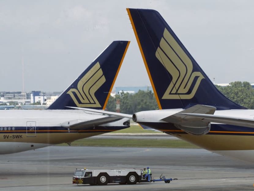 Singapore Airlines planes sit on the tarmac in Singapore's Changi Airport on March 3, 2016. Singapore Airlines planes sit on the tarmac in Singapore's Changi Airport on March 3, 2016.
