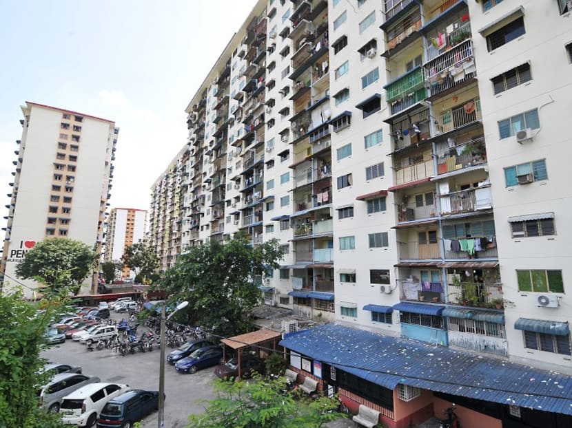 Litter strewn all over the awning below the low cost flats in Rifle Range. Photo: Malay Mail Online
