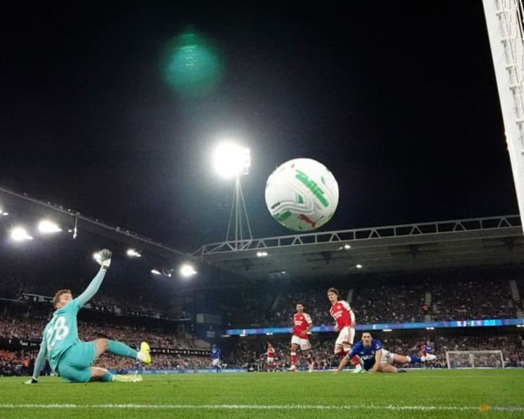 Teenager Dowman scores twice as Arsenal progress in League Cup
