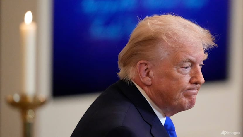 Stocks diverge, dollar down over Trump tariffs uncertainty