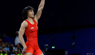 Wrestling-India's Phogat ends retirement for another crack at Olympic glory