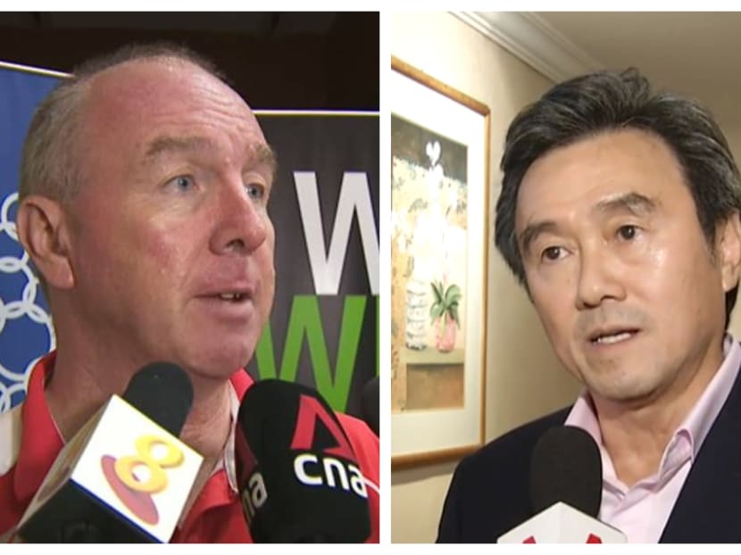Mr Tang Weng Fei (right), Singapore Athletic Association's chief, responds to the stinging criticism of the infighting among the athletics fraternity here from Mr Richard Gordon (left) of the Singapore Sports Institute.