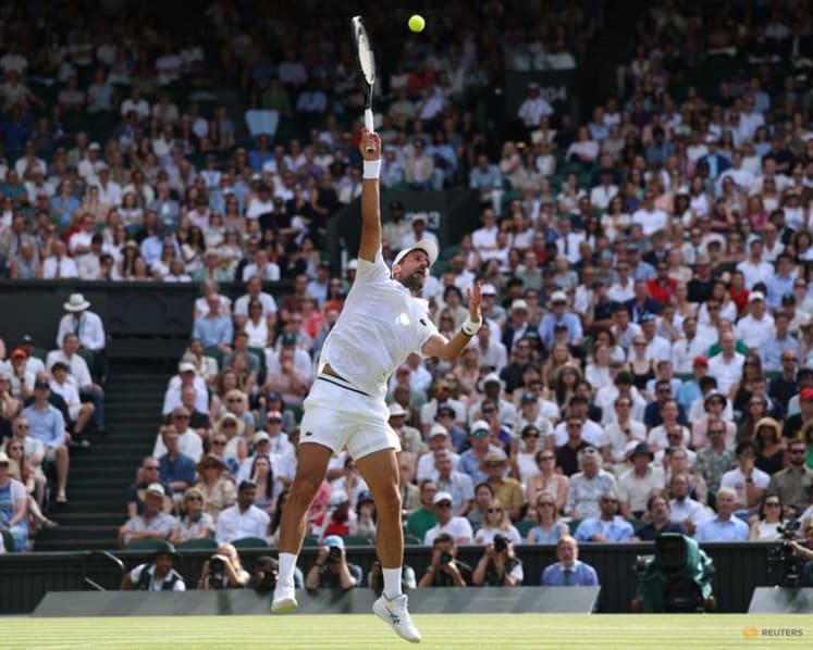 Djokovic moves past another Federer milestone to make Wimbledon quarter-finals
