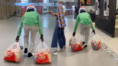 Grab Delivery Rider Seen Dragging Bags Of Food Along Suntec City Floor, Reportedly Suspended From Work
