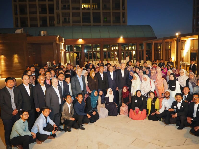 PM Lee and Mr Masagos with Singaporean students studying in Jordan during a reception hosted by Mr Lee at Grand Hyatt Amman on Saturday evening. Photo: Albert Wai