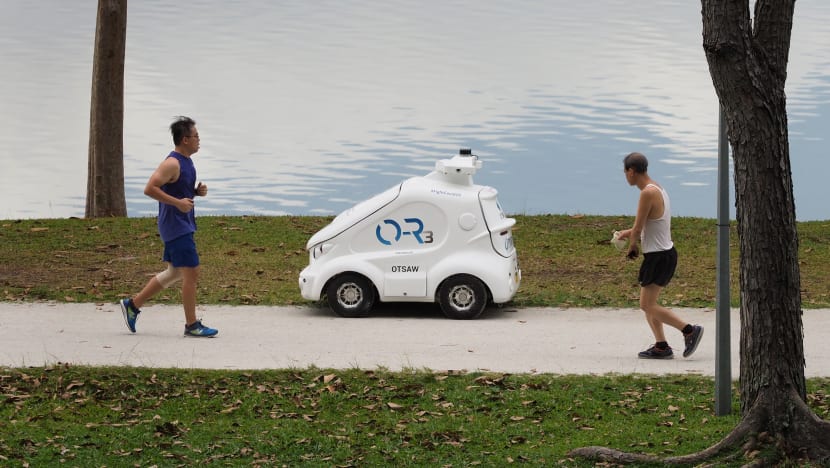 Miniature robot car goes on pedestrian paths to remind visitors to adhere to safe distancing rules