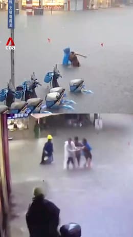 Woman in China saved by neighbours after falling in floodwater