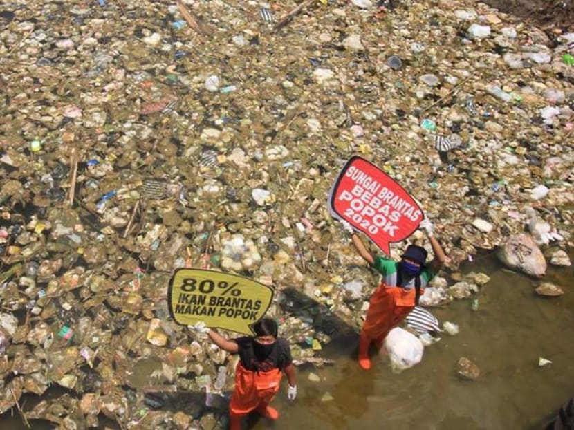 'The smell is extraordinary': Indonesia volunteers aim to free rivers of soiled diapers