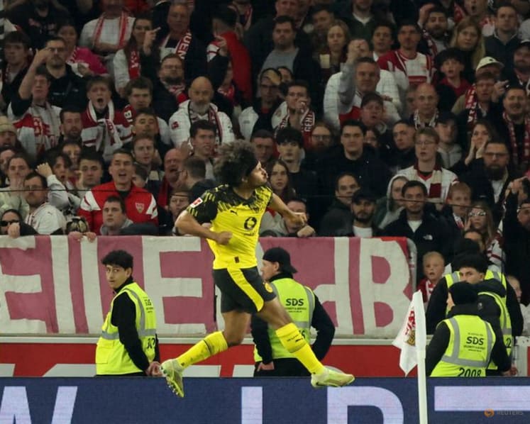 Dortmund score twice in stoppage time to beat Stuttgart 2-0