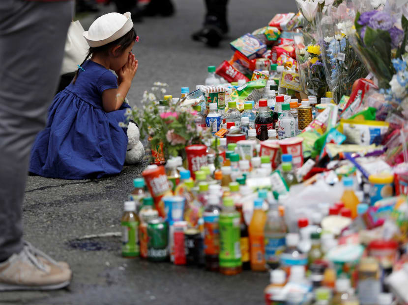 Photo of the day: A girl prays as she offers flowers for victims at the site of deadly stabbings in Kawasaki, Japan, on May 29, 2019. Photo of the day: A girl prays as she offers flowers for victims at the site of deadly stabbings in Kawasaki, Japan, on May 29, 2019.