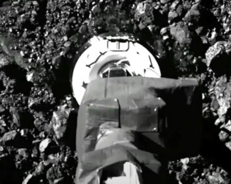 Asteroid samples escaping from jammed NASA spacecraft