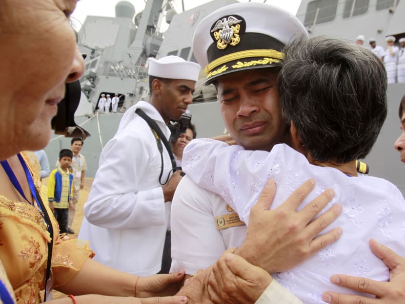 In this photo taken Dec 3, 2010, U.S. navy officer Michael "Vannak Khem" Misiewicz becomes emotional as he embraces his aunt Samrith Sokha, 72, at Cambodian coastal international see port of Sihanoukville, Cambodia. Photo: AP