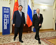 Putin trip aims to show China ties unshakeable after Trump's grand welcome