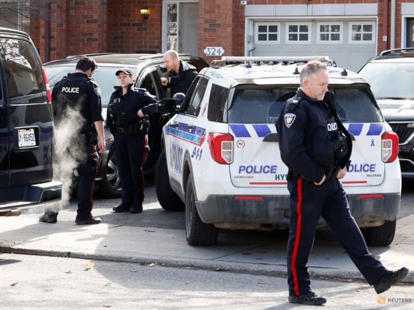 Ottawa Police Service officers surround a home after four children and two adults were found dead inside a neighbouring house in the Ottawa suburb of Barrhaven, Ontario, Canada on March 7, 2024. Ottawa Police Service officers surround a home after four children and two adults were found dead inside a neighbouring house in the Ottawa suburb of Barrhaven, Ontario, Canada on March 7, 2024.