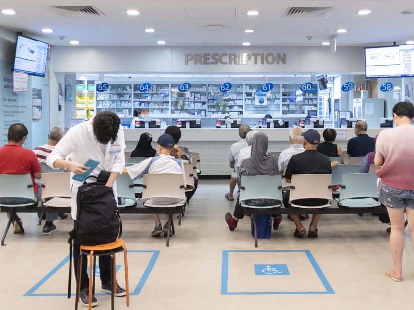 People waiting at a polyclinic to collect medication. People waiting at a polyclinic to collect medication.