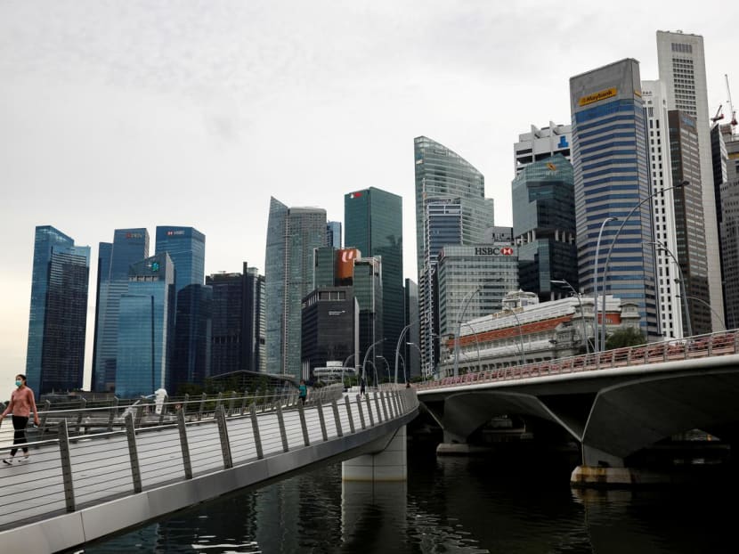 A woman wearing a protective face mask walking in Singapore's business district during a partial lockdown on May 27, 2020.