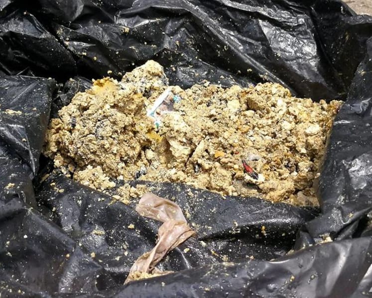 All in a day's work: Digging out condoms, hardened grease and rags from the sewers
