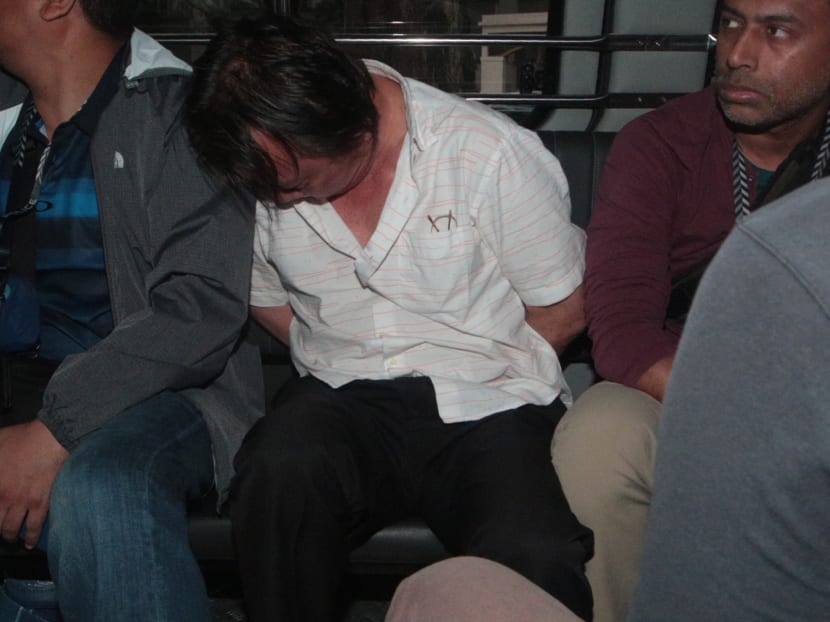 One of the suspects behind the Shell fuel heist being brought to court on Jan 13, 2017. Photo: Jason Quah / TODAY