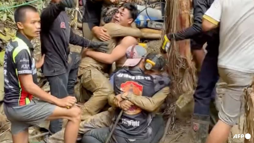 Survivors advise rescuers in search for last two stuck in Laos cave